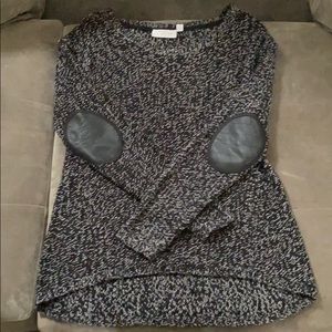 Black and white sweater with leather patched elbow